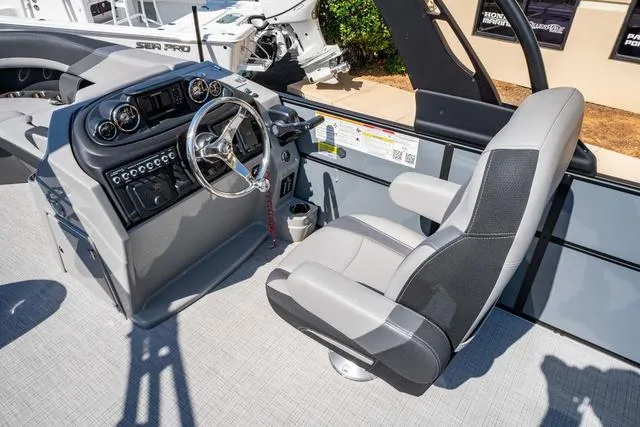 Slide: The Image of 2024 South Bay S224 UL 3.0 boat cockpit with modern steering and controls. - 22