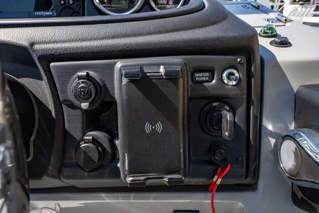 Slide: The Image of Control panel of 2024 South Bay S224 UL 3.0 boat with wireless charging pad. - 26