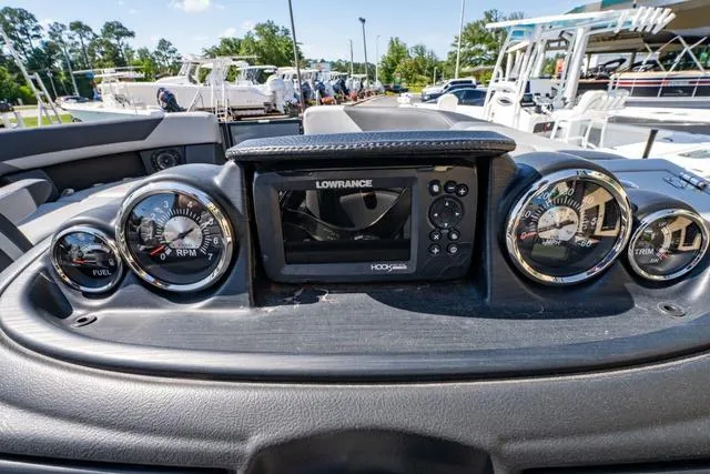 Slide: The Image of Dashboard of 2024 South Bay S224 UL 3.0 boat with gauges and Lowrance display. - 27