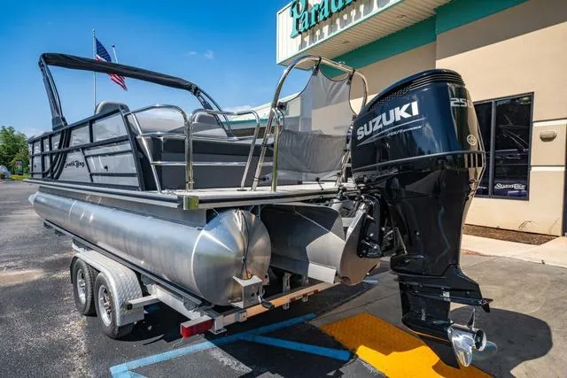Slide: The Image of 2024 South Bay S224 UL 3.0 pontoon boat with Suzuki 250 outboard motor on trailer. - 3