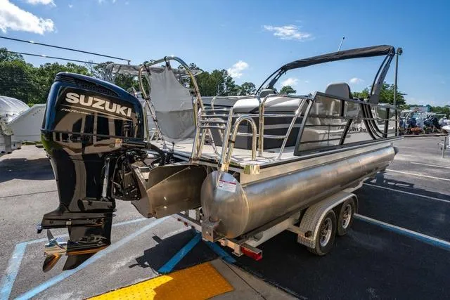 Slide: The Image of 2024 South Bay S224 UL 3.0 pontoon boat with Suzuki outboard motor on trailer. - 5