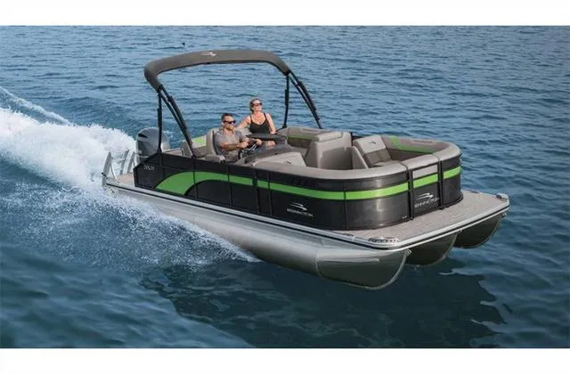 Slide: The Image of 2022 Bennington 22 SXFAPG pontoon boat cruising on open water. - 21