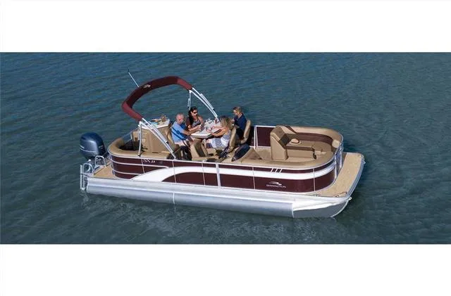 Slide: The Image of 2022 Bennington 22 SXFAPG pontoon boat on water, featuring dual stern gates. - 22