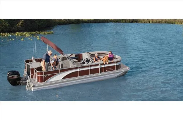 Slide: The Image of 2022 Bennington 22 SXFAPG pontoon boat on a lake with passengers enjoying the ride. - 23