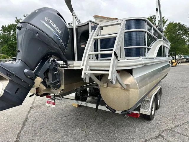 Slide: The Image of 2022 Bennington 22 SXFAPG pontoon boat with Yamaha engine on trailer. - 3