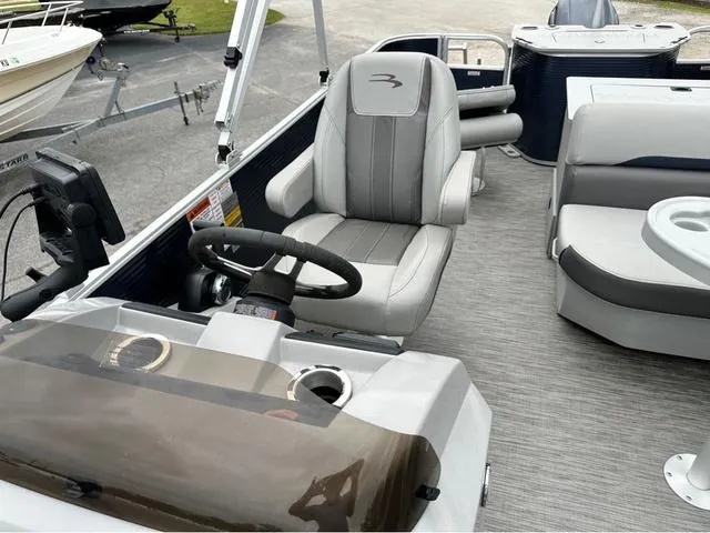 Slide: The Image of 2022 Bennington 22 SXFAPG fishing boat interior with steering console and seating. - 7
