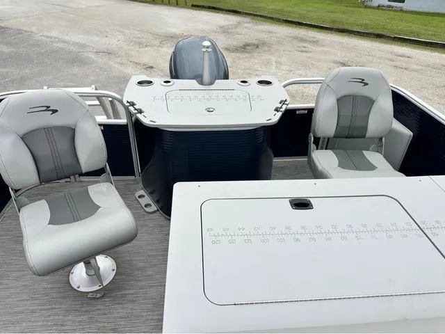 Slide: The Image of 2022 Bennington 22 SXFAPG fishing boat interior with dual stern gates and seating. - 8