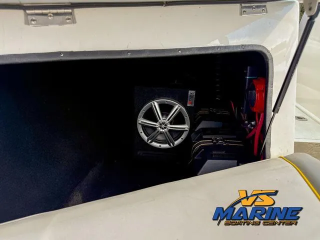 Slide: The Image of Storage compartment of a 2006 Centurion ELITE V boat with audio equipment. - 12