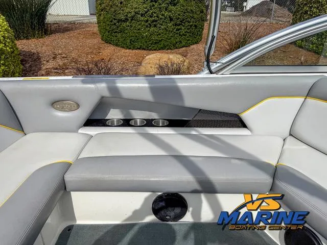 Slide: The Image of 2006 Centurion ELITE V boat interior with gray seating and cup holders. - 13