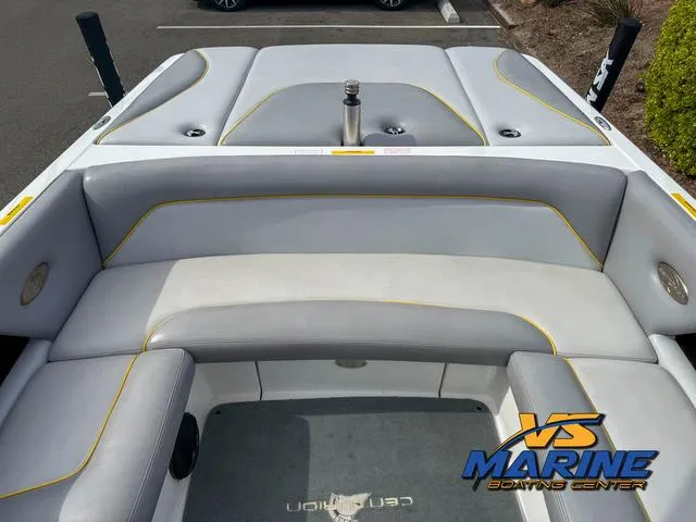 Slide: The Image of 2006 Centurion ELITE V boat interior with gray seating and yellow accents at VS Marine Boating Center. - 14