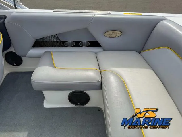 Slide: The Image of 2006 Centurion ELITE V boat interior with gray seating and yellow trim, featuring VS Marine logo. - 15