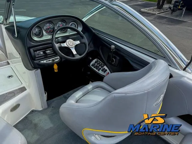 Slide: The Image of 2006 Centurion ELITE V boat cockpit with steering wheel and dashboard controls. - 16