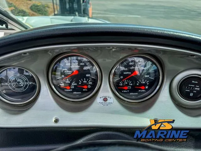 Slide: The Image of 2006 Centurion ELITE V boat dashboard with gauges and VS Marine logo. - 18