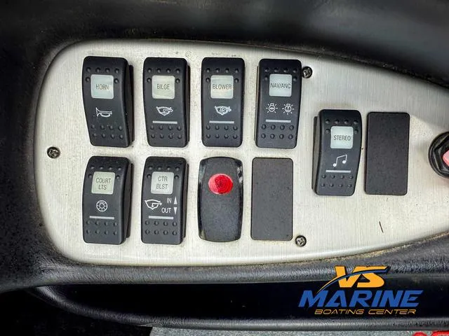 Slide: The Image of Control panel of a 2006 Centurion ELITE V boat with various switches. - 20