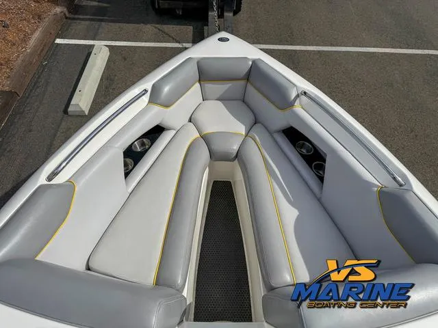 Slide: The Image of 2006 Centurion ELITE V boat interior with gray seating and cup holders, VS Marine logo visible. - 21