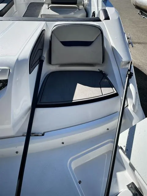 Slide: The Image of 2022 Hurricane SunDeck Sport 205 IO boat interior with seating and storage compartments. - 10