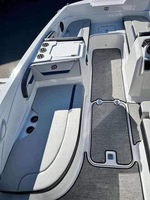 Slide: The Image of 2022 Hurricane SunDeck Sport 205 IO interior with seating and storage compartments. - 11