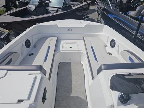 Slide: The Image of 2022 Hurricane SunDeck Sport 205 IO boat interior with seating and storage compartments. - 12