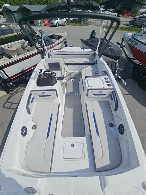 Slide: The Image of 2022 Hurricane SunDeck Sport 205 IO boat with spacious seating and modern design. - 13