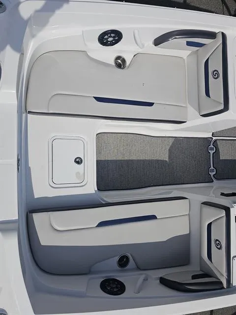 Slide: The Image of 2022 Hurricane SunDeck Sport 205 IO interior with gray seating and carpeted flooring. - 14