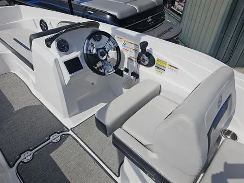 Slide: The Image of 2022 Hurricane SunDeck Sport 205 IO boat interior with steering wheel and seating. - 15