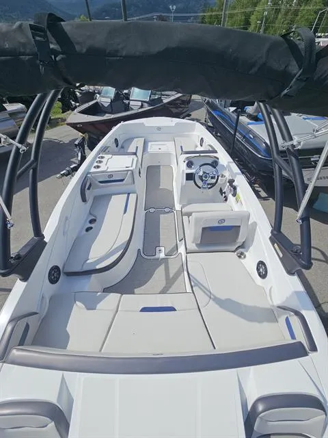 Slide: The Image of 2022 Hurricane SunDeck Sport 205 IO boat with spacious seating and sleek design. - 6