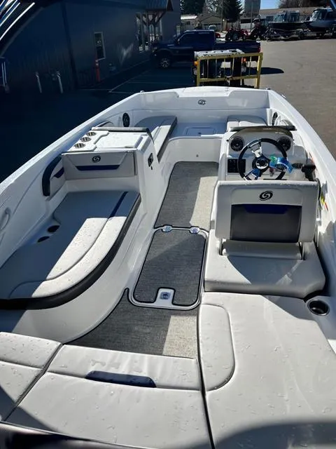 Slide: The Image of 2022 Hurricane SunDeck Sport 205 IO boat interior with seating and steering wheel. - 8