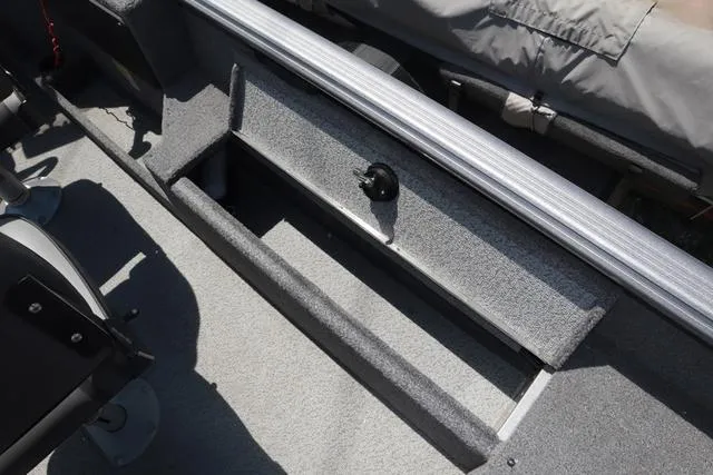 Slide: The Image of 2018 Lund 1875 Impact SC boat interior with storage compartment and seating. - 11