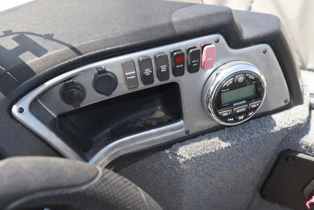 Slide: The Image of Control panel of 2018 Lund 1875 Impact SC boat with switches and audio system. - 15