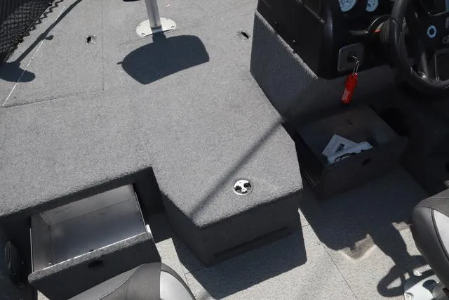 Slide: The Image of 2018 Lund 1875 Impact SC boat interior with storage compartments and seating. - 16