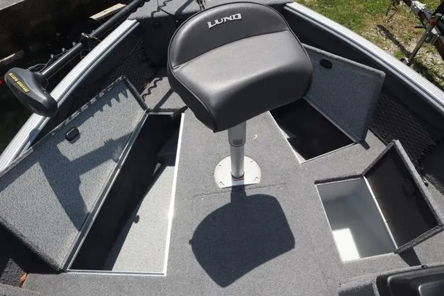Slide: The Image of 2018 Lund 1875 Impact SC boat interior with storage compartments and seat. - 20