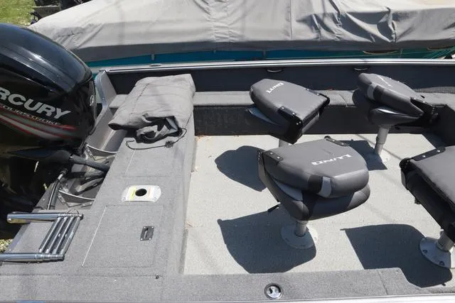 Slide: The Image of 2018 Lund 1875 Impact SC boat interior with Mercury engine and seating arrangement. - 6