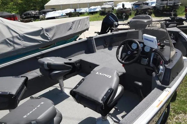 Slide: The Image of 2018 Lund 1875 Impact SC boat interior with seating and control panel. - 7