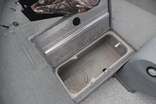 Slide: The Image of Open storage compartment in 2013 Tracker Super Guide V-16 SC boat. - 6