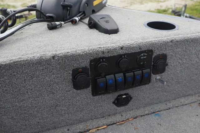 Slide: The Image of Control panel of 2013 Tracker Super Guide V-16 SC boat with switches and wiring. - 7