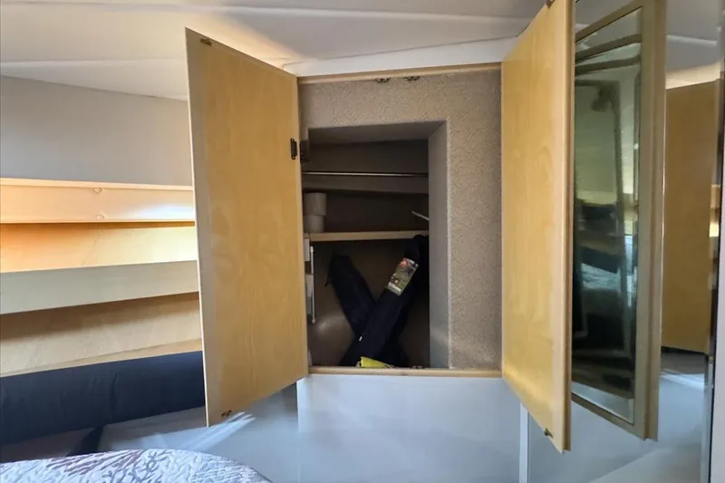 Slide: The Image of Open wooden cabinet in 1994 President 445 Sundeck yacht interior. - 105