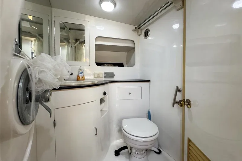 Slide: The Image of Bathroom interior of 1994 President 445 Sundeck yacht, featuring toilet and vanity. - 106