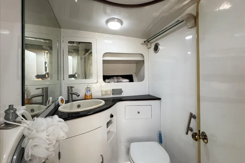 Slide: The Image of Bathroom interior of 1994 President 445 Sundeck yacht, featuring sink and toilet. - 107