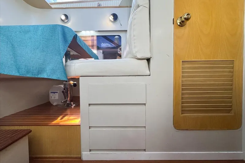 Slide: The Image of Interior of 1994 President 445 Sundeck yacht with seating and wooden accents. - 110