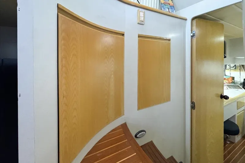 Slide: The Image of Interior of 1994 President 445 Sundeck yacht with wooden paneling and open door. - 112