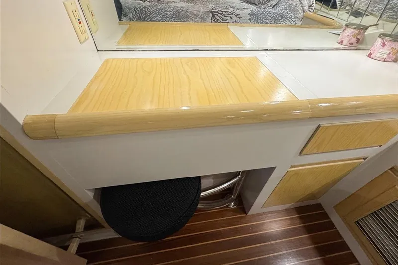 Slide: The Image of 1994 President 445 Sundeck interior with wooden cabinetry and mirror. - 126