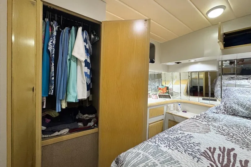 Slide: The Image of Cozy bedroom in 1994 President 445 Sundeck yacht with wardrobe and mirrored vanity. - 129