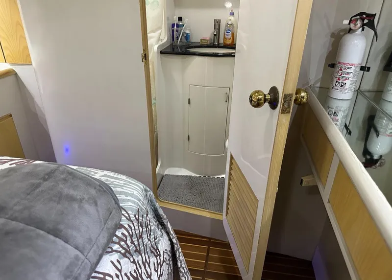 Slide: The Image of 1994 President 445 Sundeck yacht interior with chairs and stairs, featuring sleek design elements. - 13