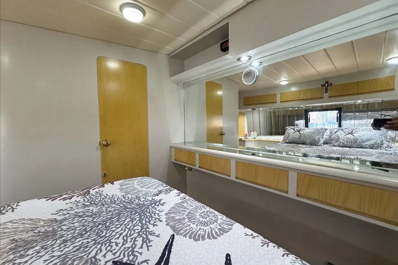 Slide: The Image of Interior of 1994 President 445 Sundeck yacht with cozy bedroom and modern decor. - 130