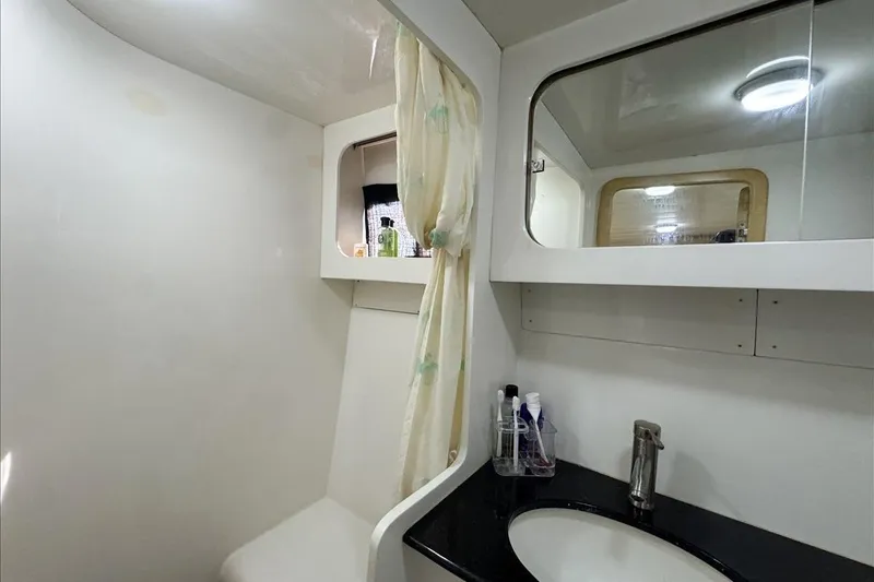 Slide: The Image of Bathroom interior of 1994 President 445 Sundeck yacht, featuring sink and mirror. - 135
