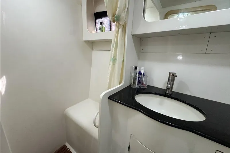 Slide: The Image of Bathroom interior of 1994 President 445 Sundeck yacht, featuring sink and storage. - 136