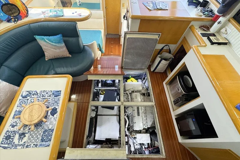 Slide: The Image of Interior of 1994 President 445 Sundeck yacht with open engine compartment. - 139
