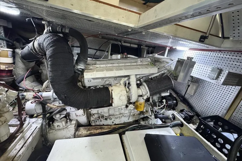 Slide: The Image of Engine room of a 1994 President 445 Sundeck yacht, showcasing mechanical components. - 141