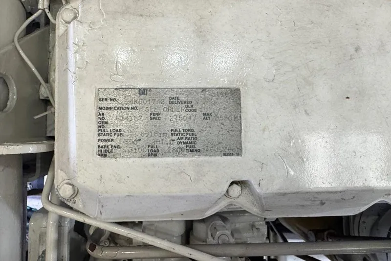 Slide: The Image of Engine label on a 1994 President 445 Sundeck boat, displaying specifications and serial numbers. - 146