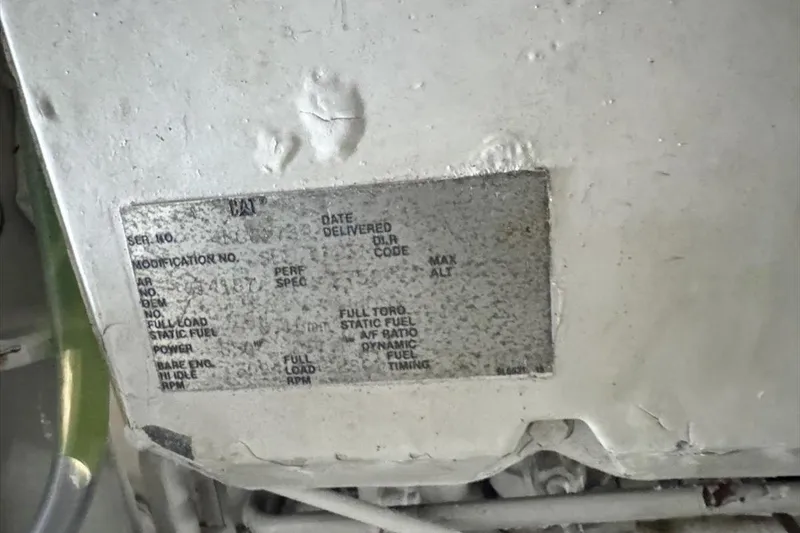 Slide: The Image of 1994 President 445 Sundeck engine plate with specifications and serial number details. - 147